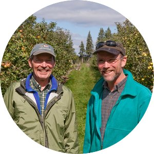 David Bedford and Jim Luby in an apple orchard